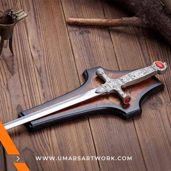 Gryffindor sword replica with ruby-studded hilt and silver blade, Iconic sword from the Harry Potter series, High-quality replica with detailed magical engravings, Fantasy sword of Godric Gryffindor with ornate guard, Display-worthy Gryffindor sword collectible for fans and wizards