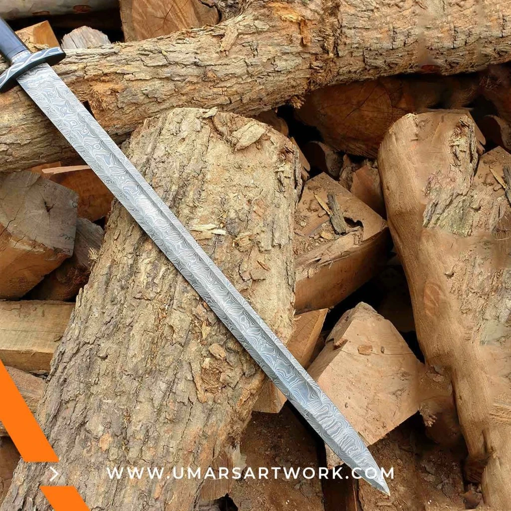 Damascus sword with distinctive wavy blade pattern and high-carbon steel, Hand-forged sword known for strength and sharpness, High-quality Damascus steel blade with elegant design, Functional sword with full-tang construction and durable grip, Display-worthy collectible showcasing traditional forging craftsmanship