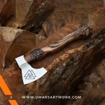 Viking axe with traditional Norse design and engraved steel head, Hand-forged blade inspired by ancient Viking warriors, High-quality axe with sturdy wooden handle for firm grip, Battle-ready replica ideal for display or functional use, Authentic Viking axe collectible with historical craftsmanship