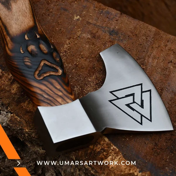 Viking axe with traditional Norse design and engraved steel head, Hand-forged blade inspired by ancient Viking warriors, High-quality axe with sturdy wooden handle for firm grip, Battle-ready replica ideal for display or functional use, Authentic Viking axe collectible with historical craftsmanship