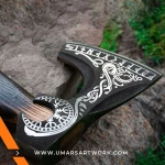 Viking axe with traditional Norse design and engraved steel head, Hand-forged blade inspired by ancient Viking warriors, High-quality axe with sturdy wooden handle for firm grip, Battle-ready replica ideal for display or functional use, Authentic Viking axe collectible with historical craftsmanship