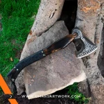 Viking axe with traditional Norse design and engraved steel head, Hand-forged blade inspired by ancient Viking warriors, High-quality axe with sturdy wooden handle for firm grip, Battle-ready replica ideal for display or functional use, Authentic Viking axe collectible with historical craftsmanship