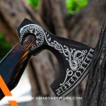 Viking axe with traditional Norse design and engraved steel head, Hand-forged blade inspired by ancient Viking warriors, High-quality axe with sturdy wooden handle for firm grip, Battle-ready replica ideal for display or functional use, Authentic Viking axe collectible with historical craftsmanship