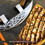 Pizza axe with fun and unique axe-shaped blade design, Stainless steel cutting edge perfect for slicing pizzas with ease, Ergonomic handle for comfortable and safe use, Novelty kitchen tool combining function and style, High-quality pizza cutter shaped like a miniature battle axe