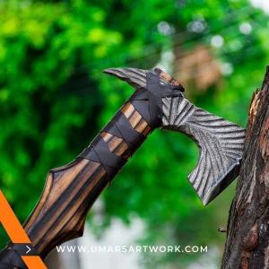 Viking axe with traditional Norse design and engraved steel head, Hand-forged blade inspired by ancient Viking warriors, High-quality axe with sturdy wooden handle for firm grip, Battle-ready replica ideal for display or functional use, Authentic Viking axe collectible with historical craftsmanship