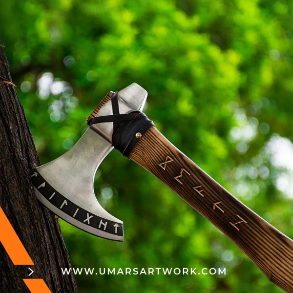 Viking axe with traditional Norse design and engraved steel head, Hand-forged blade inspired by ancient Viking warriors, High-quality axe with sturdy wooden handle for firm grip, Battle-ready replica ideal for display or functional use, Authentic Viking axe collectible with historical craftsmanship