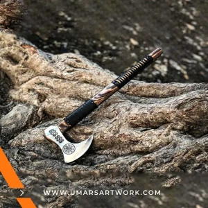 Viking axe with traditional Norse design and engraved steel head, Hand-forged blade inspired by ancient Viking warriors, High-quality axe with sturdy wooden handle for firm grip, Battle-ready replica ideal for display or functional use, Authentic Viking axe collectible with historical craftsmanship