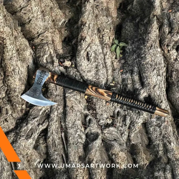 Viking axe with traditional Norse design and engraved steel head, Hand-forged blade inspired by ancient Viking warriors, High-quality axe with sturdy wooden handle for firm grip, Battle-ready replica ideal for display or functional use, Authentic Viking axe collectible with historical craftsmanship