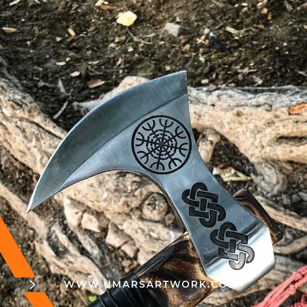 Viking axe with traditional Norse design and engraved steel head, Hand-forged blade inspired by ancient Viking warriors, High-quality axe with sturdy wooden handle for firm grip, Battle-ready replica ideal for display or functional use, Authentic Viking axe collectible with historical craftsmanship