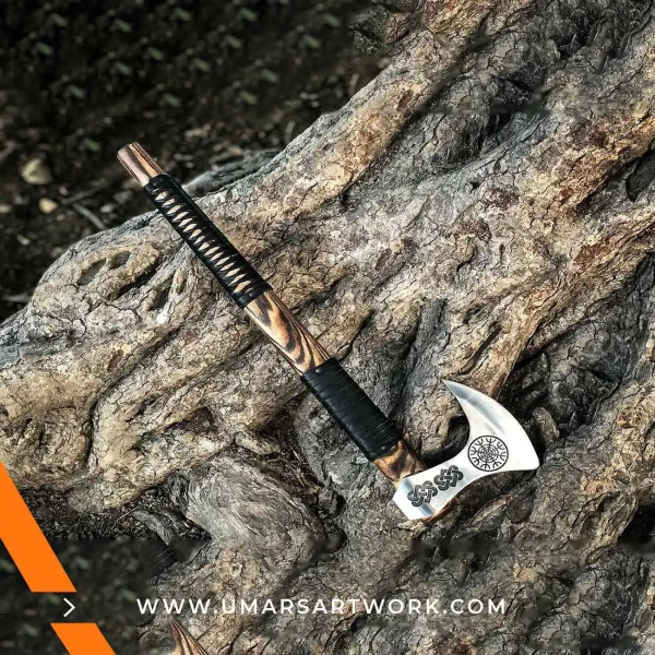 Viking axe with traditional Norse design and engraved steel head, Hand-forged blade inspired by ancient Viking warriors, High-quality axe with sturdy wooden handle for firm grip, Battle-ready replica ideal for display or functional use, Authentic Viking axe collectible with historical craftsmanship