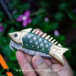 Handcrafted fish-shaped pocket knife for collectors.