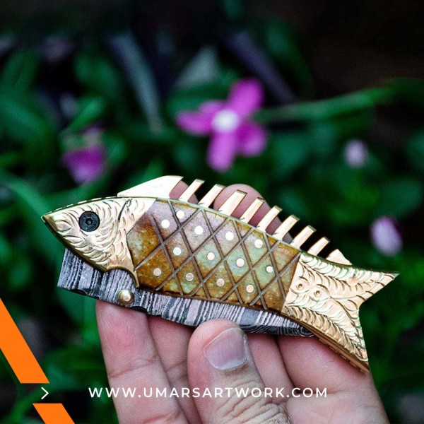 Compact fish-shaped pocket knife for everyday use.