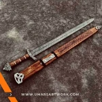 Hand-forged Damascus steel Viking sword with distinctive blade patterns, Sharp battle-ready sword inspired by Norse warriors, High-quality medieval sword with full-tang construction, Authentic replica with leather-wrapped grip and engraved guard, Display-worthy collectible combining Viking and medieval craftsmanship