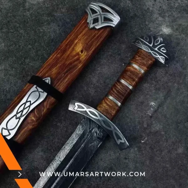 Hand-forged Damascus steel Viking sword with distinctive blade patterns, Sharp battle-ready sword inspired by Norse warriors, High-quality medieval sword with full-tang construction, Authentic replica with leather-wrapped grip and engraved guard, Display-worthy collectible combining Viking and medieval craftsmanship