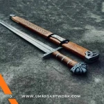 Hand-forged Damascus steel Viking sword with distinctive blade patterns, Sharp battle-ready sword inspired by Norse warriors, High-quality medieval sword with full-tang construction, Authentic replica with leather-wrapped grip and engraved guard, Display-worthy collectible combining Viking and medieval craftsmanship